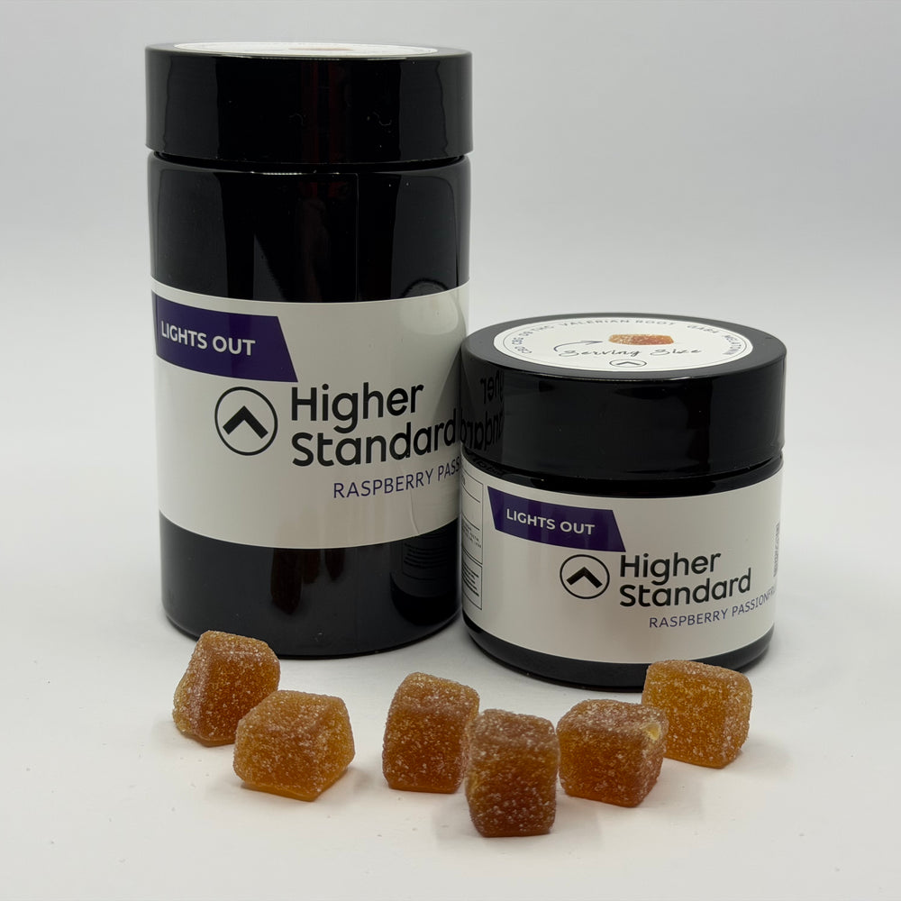 Higher Standard Lights Out cannabinoid gummies with jar and serving pieces, functional cannabinoid gummies for recovery and cannabis fitness routines.