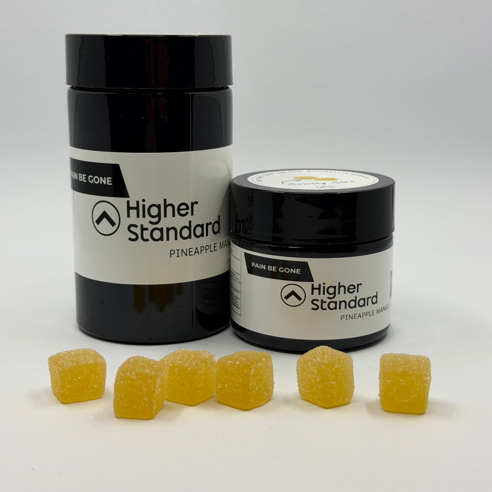 Higher Standard Pain Be Gone CBD, CBN, and THC gummies for pain relief with jar and pineapple-flavored cannabinoid gummies.